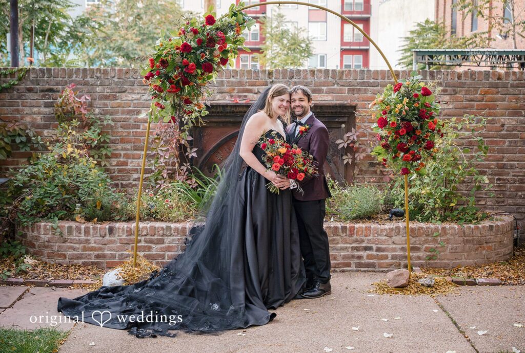 Denver wedding photographers from Original Weddings capturing bride and groom smiling while taking picture at The Lobby
