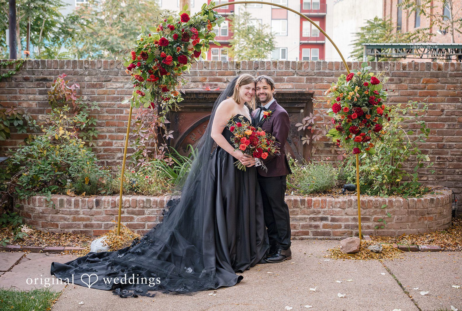 Denver wedding photographers from Original Weddings capturing bride and groom smiling while taking picture at The Lobby