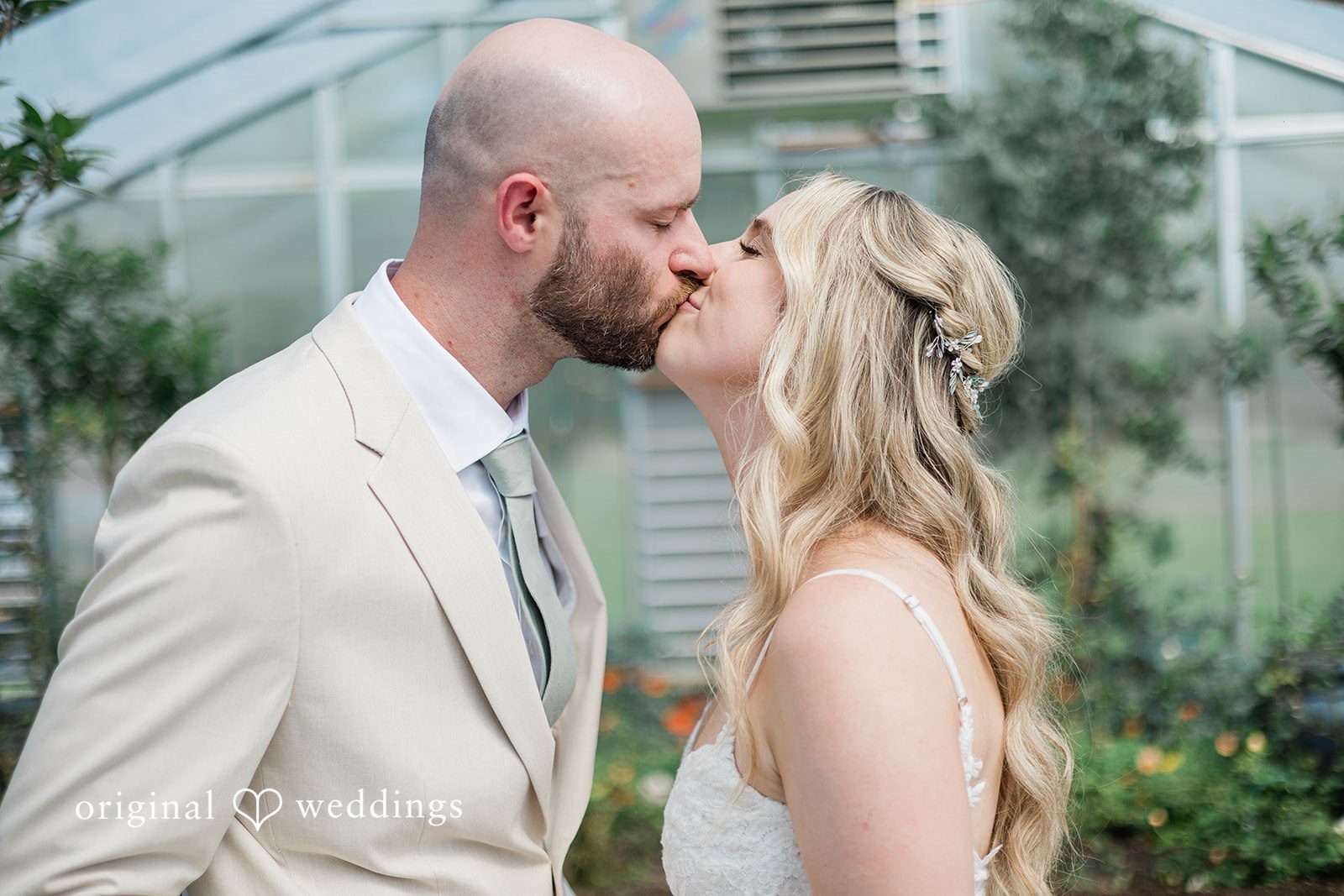 Lily + Robert The couple shares a romantic kiss
