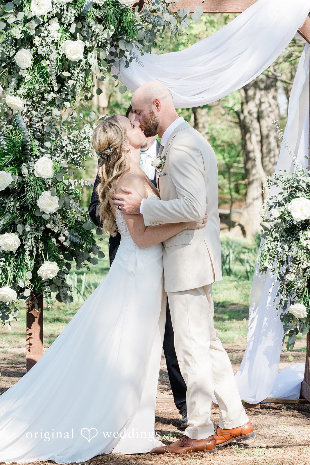 Lily + Robert The couple takes their first kiss
