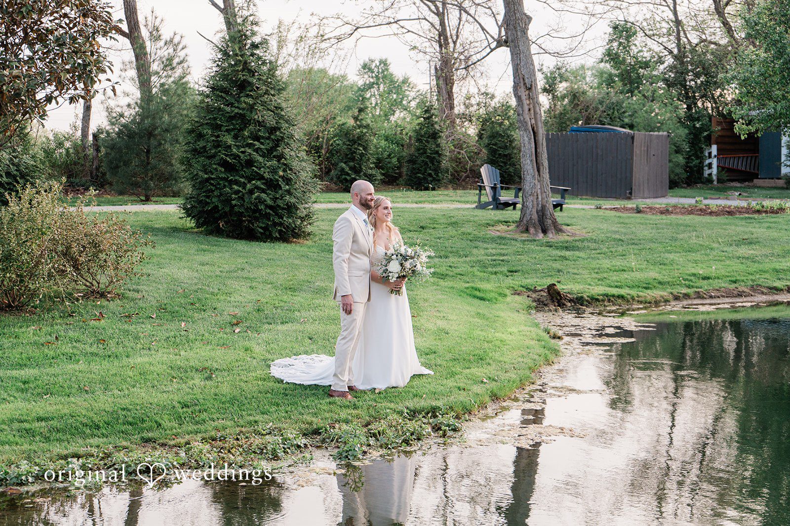 Lily + Robert Our Cincinnati wedding photographers captured a portrait of the couple by the lake side