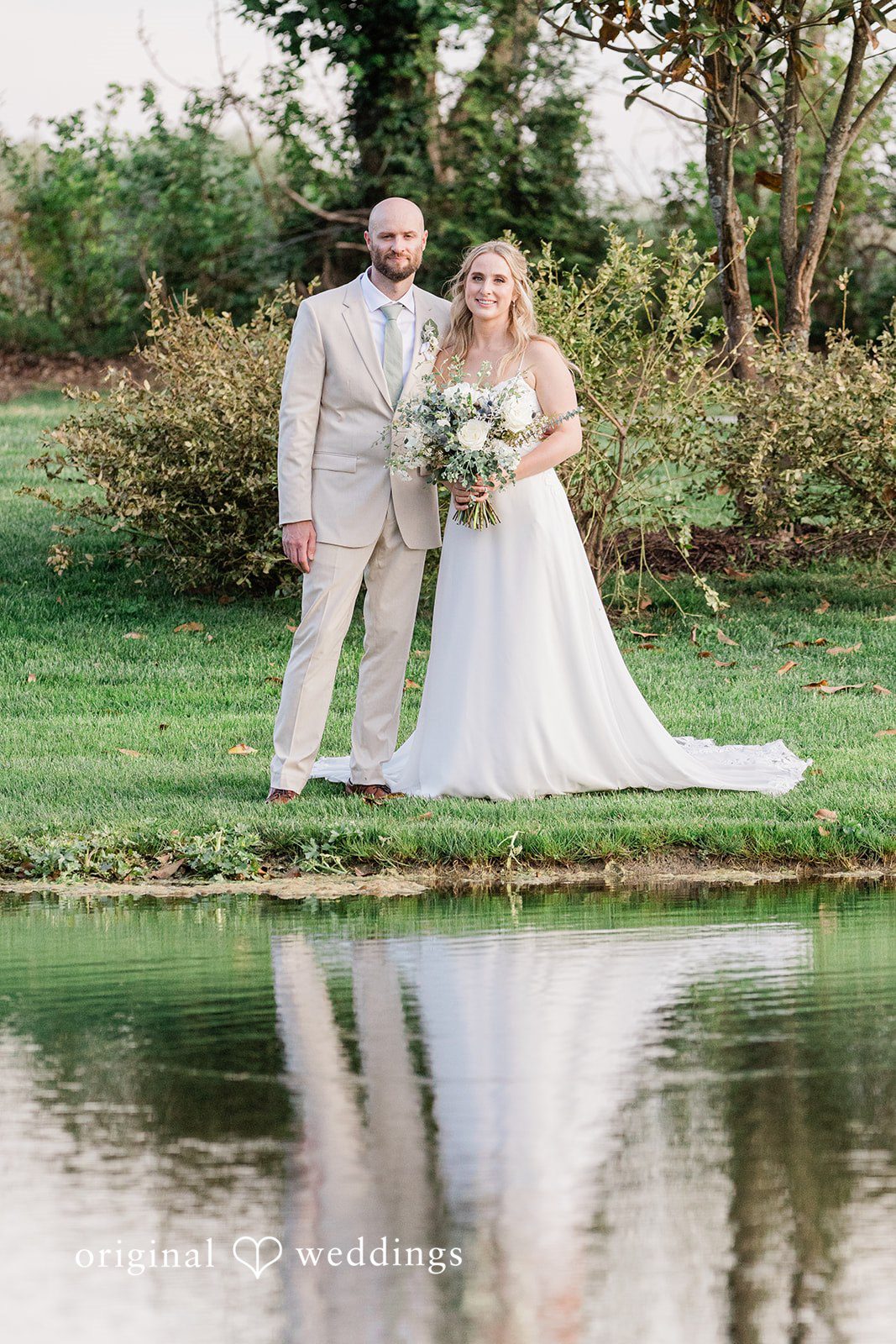 Lily + Robert Our Cincinnati wedding photographers captured a beautiful portrait of the couple by the lake