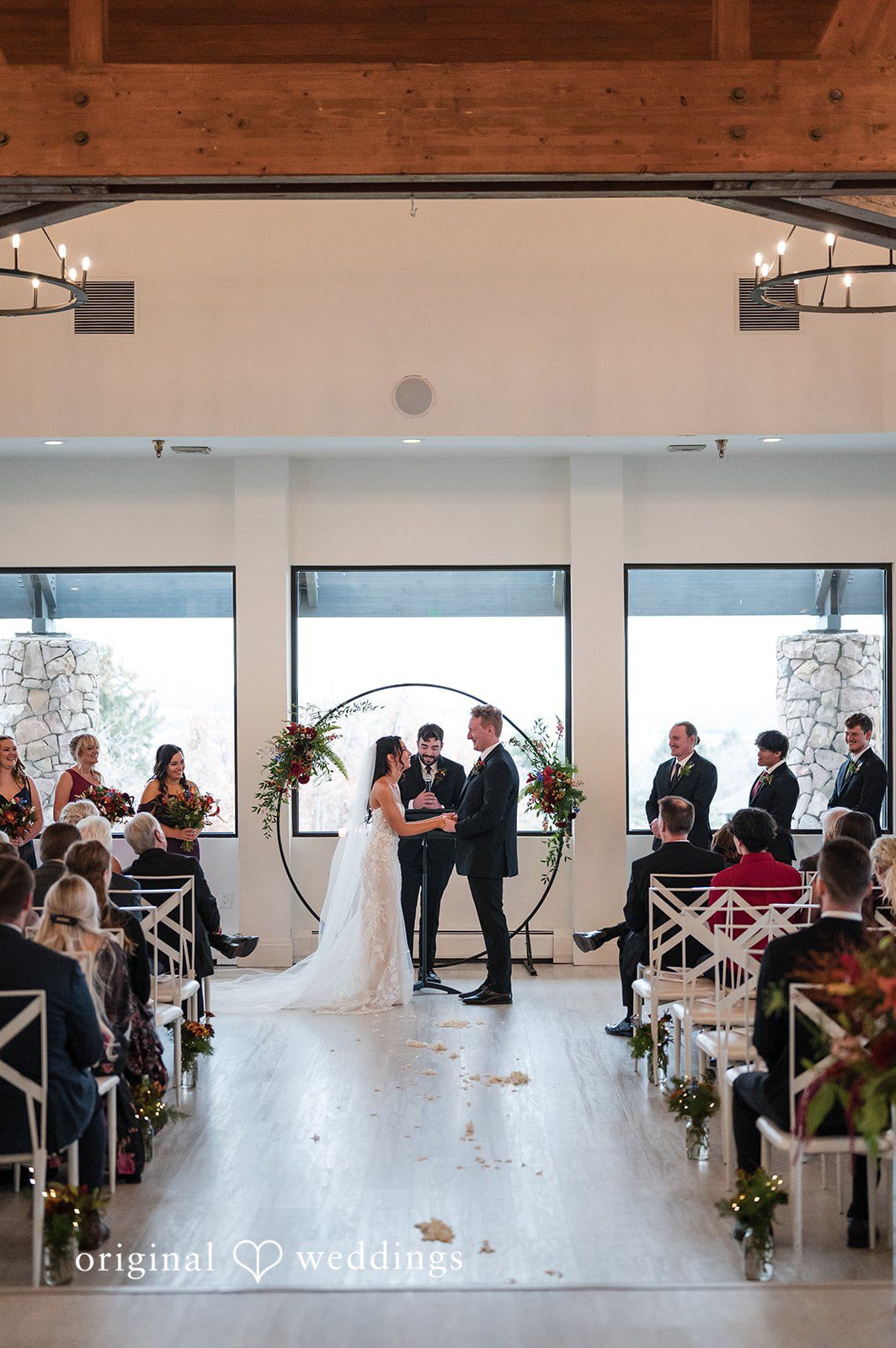 Denver Wedding Photographers capturing couple holding hands and looking at each other at The Oaks by Original Weddings