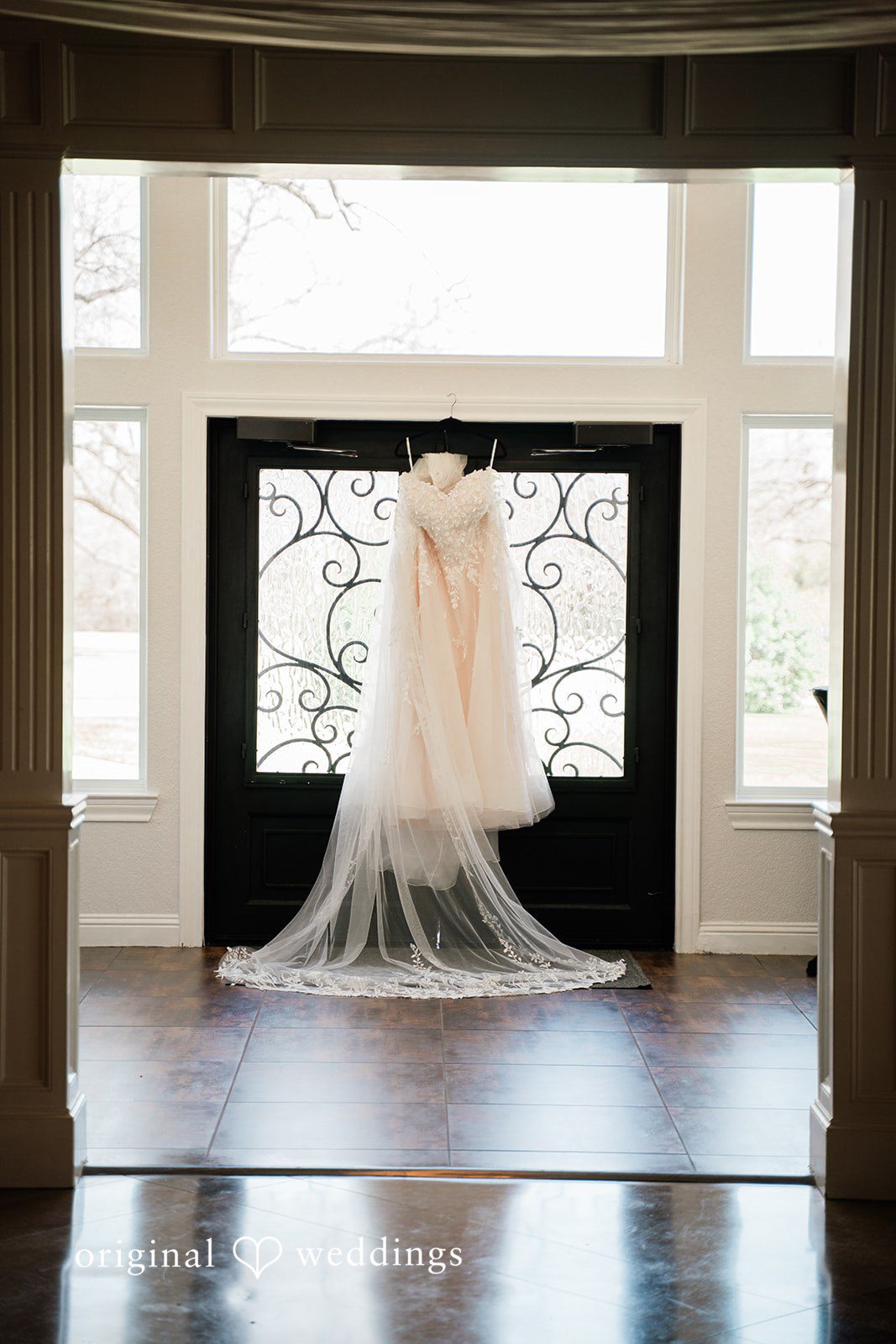 The bride's wedding dress gracefully hanging at the lodge