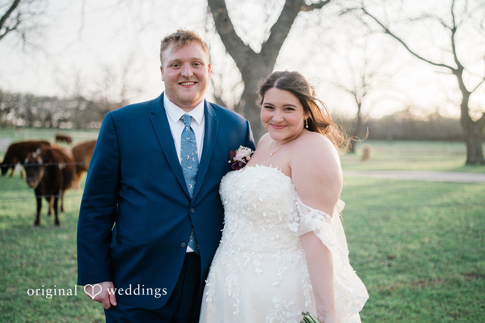 A beautiful portrait of the couple by the Orchard Event Venue & Retreat's field