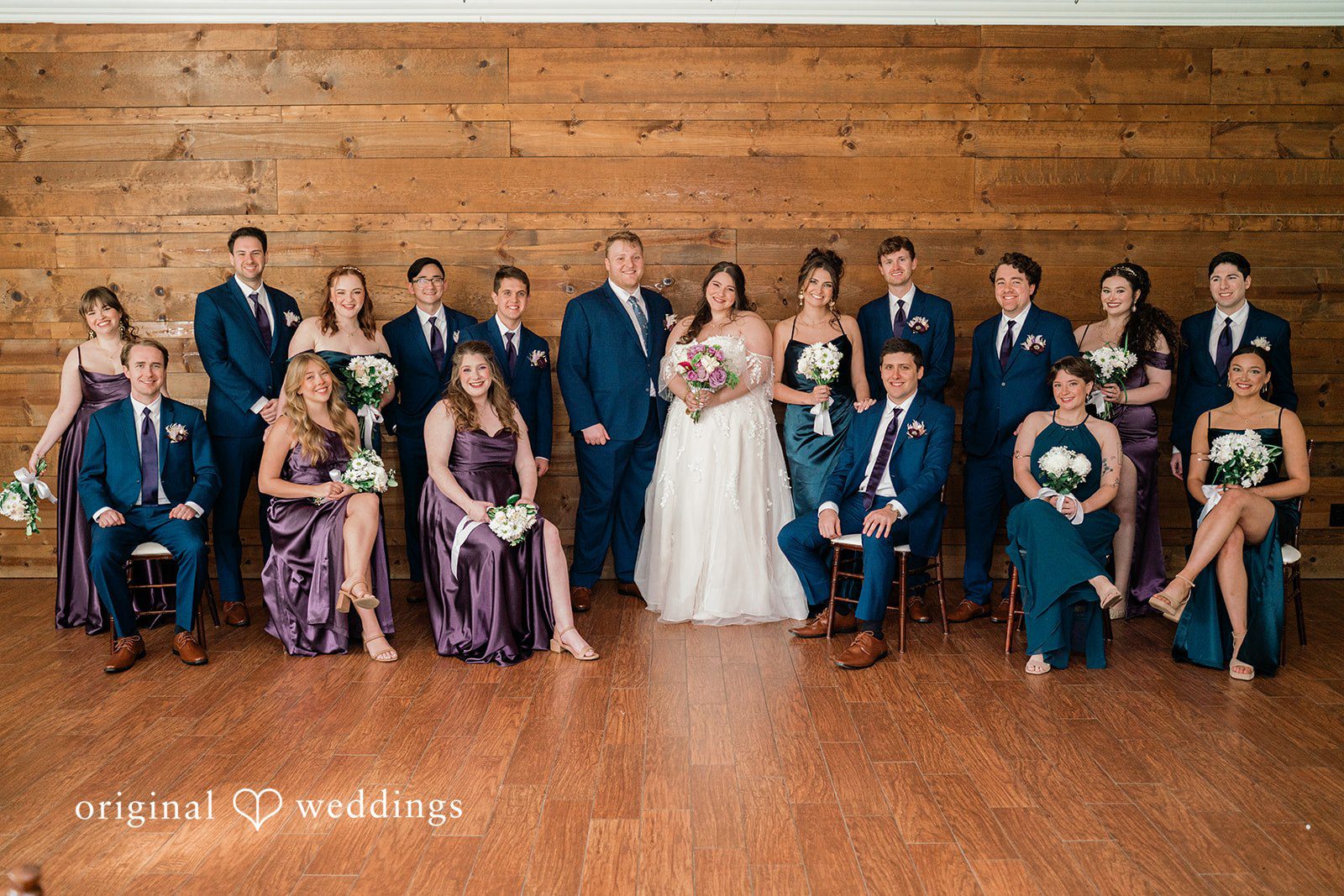Our Dallas wedding photographers captured a beautiful portrait of the couple and their bridal party at The Orchard Event Venue & Retreat