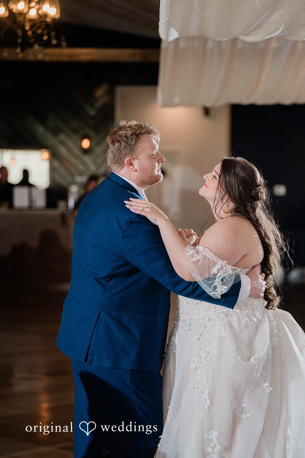 The couple takes their first dance