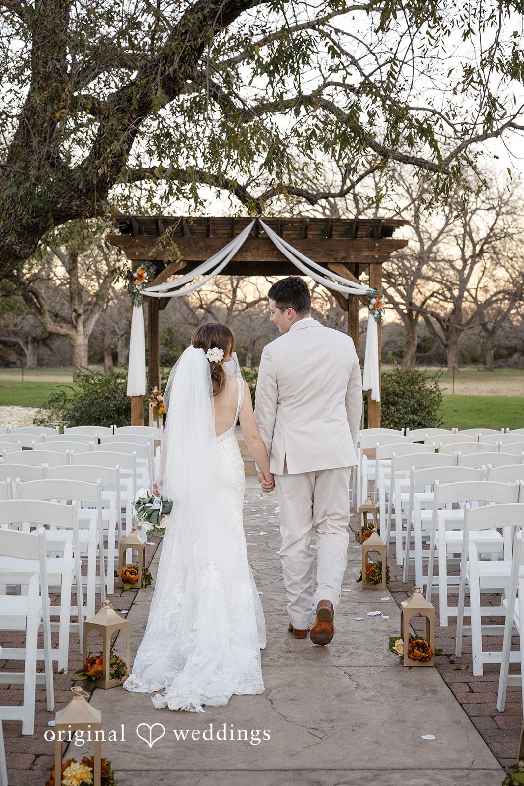 Bonnie + Aksel Romantic bride and groom back view at The Orchard Event Venue & Retreat