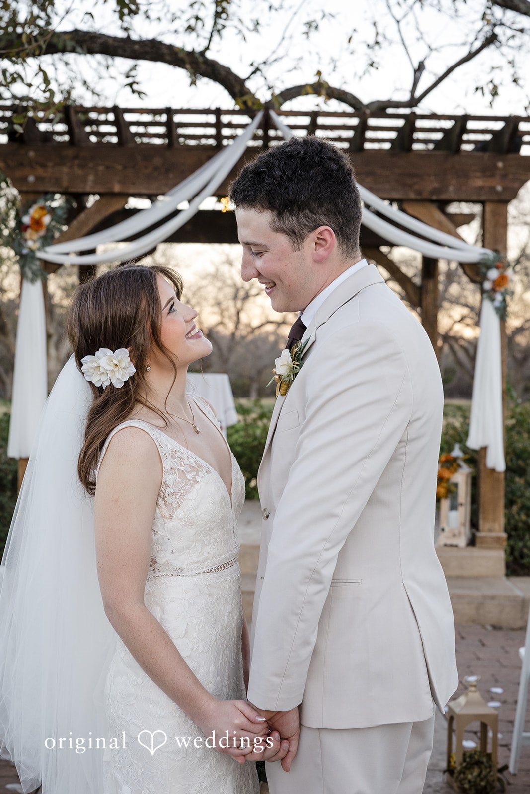 Bonnie + Aksel Dallas Wedding Photographers capturing couple looking at each other during ceremony at The Orchard Event Venue & Retreat by Original Weddings