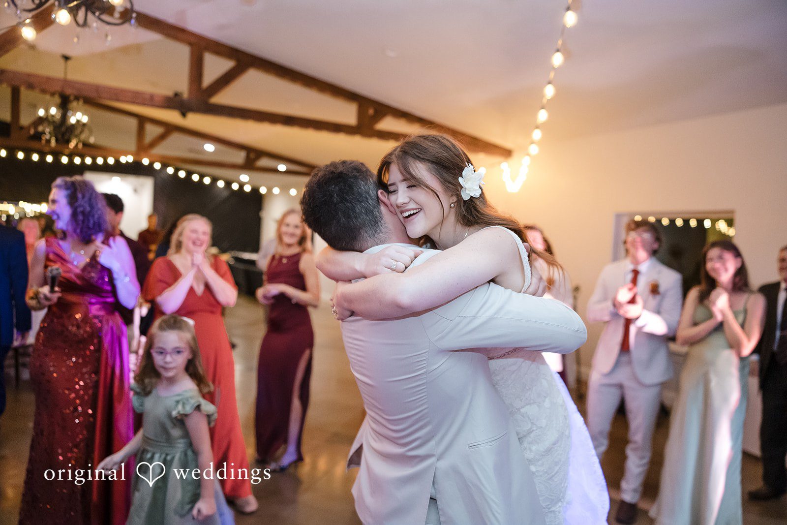 Bonnie + Aksel Elegant bride and groom hug moment at The Orchard Event Venue & Retreat