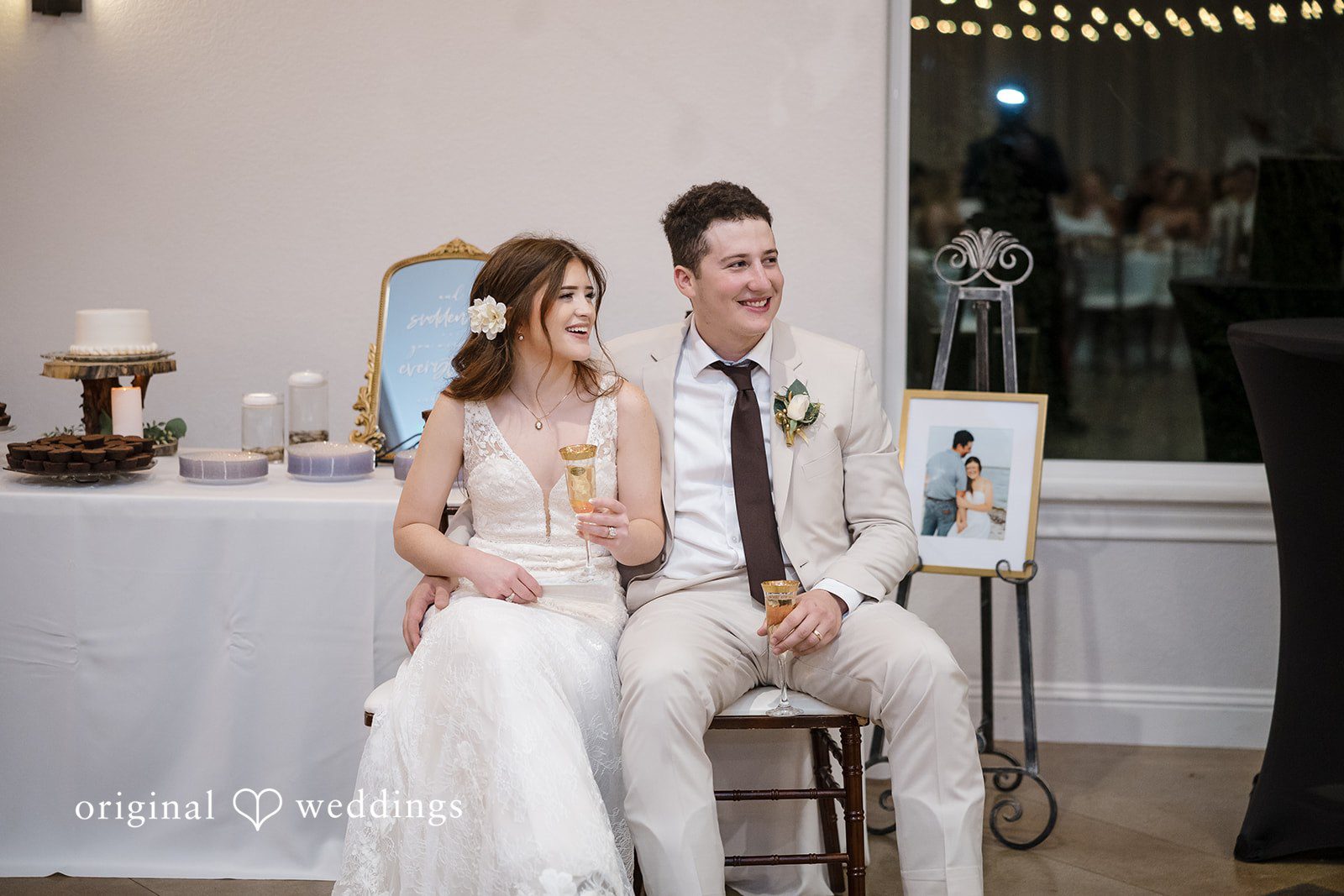 Bonnie + Aksel Dallas Wedding Photographers capturing couple seated on reception chairs at The Orchard Event Venue & Retreat by Original Weddings