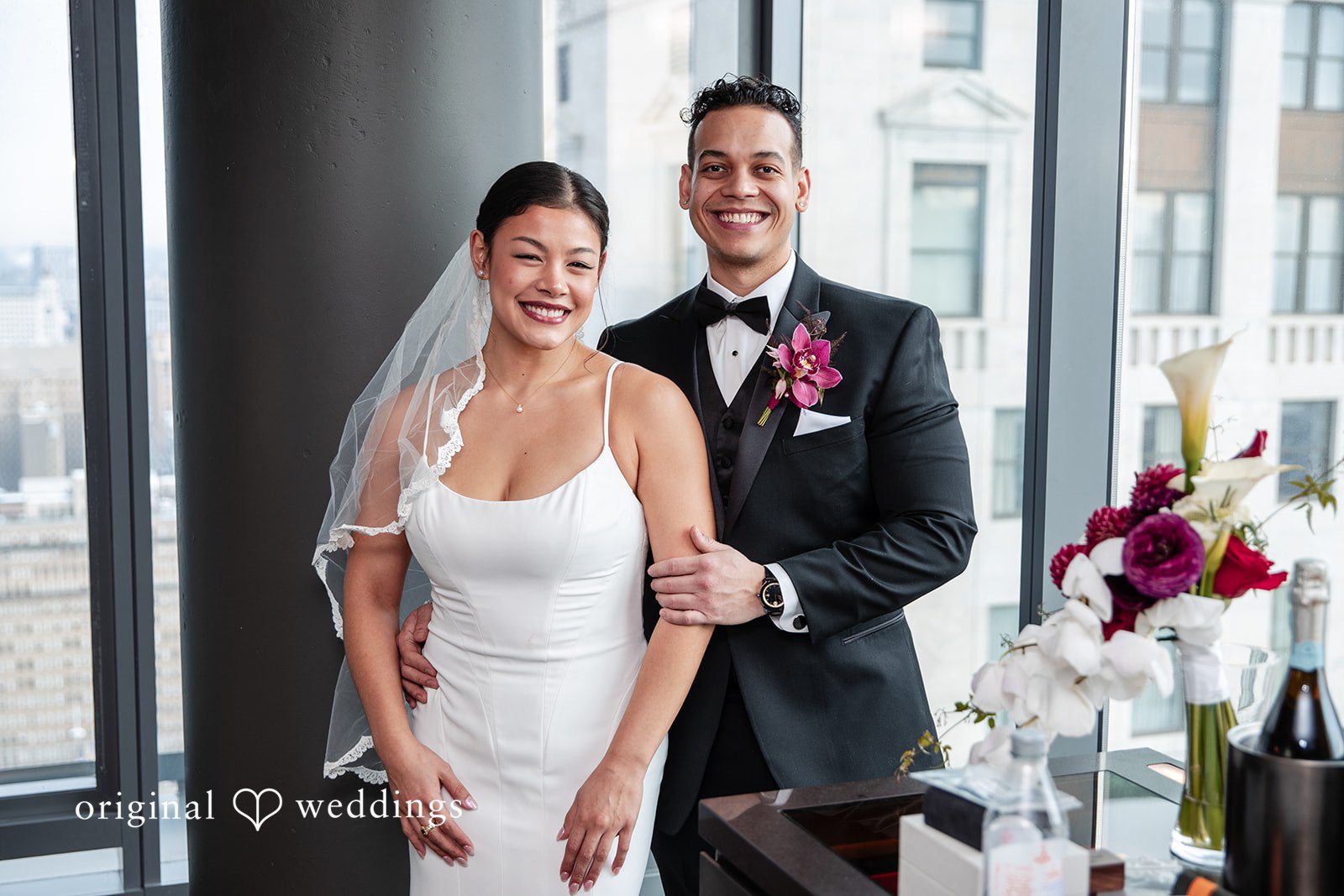 Amanda + Emmanuel Bride and groom smiling together at The Philadelphia Wedding Chapel at Sherman Mills.
