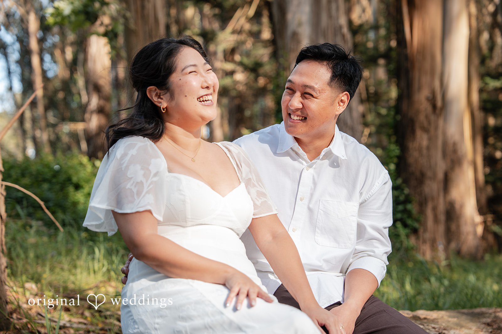 San Francisco Engagement Photography by Original Weddings capturing a joyful and smilling moment between the couple during their engagement session at The Presidio