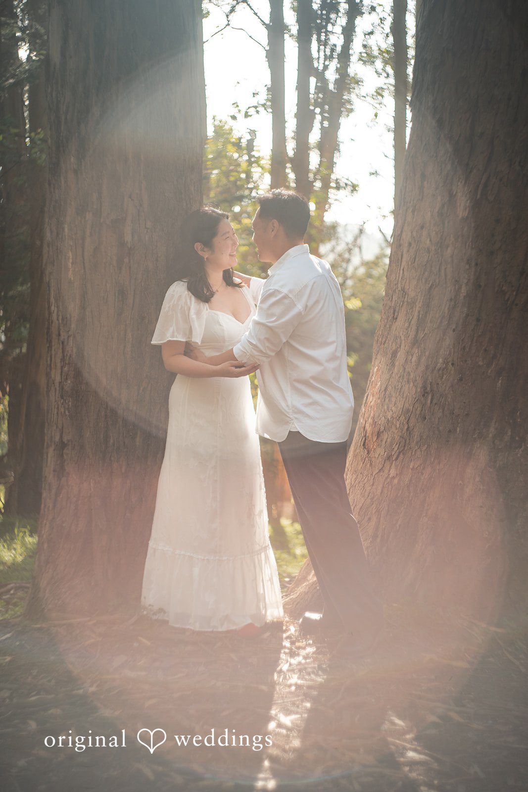 San Francisco Engagement Photography by Original Weddings capturing a romantic moment under the sun at The Presidio
