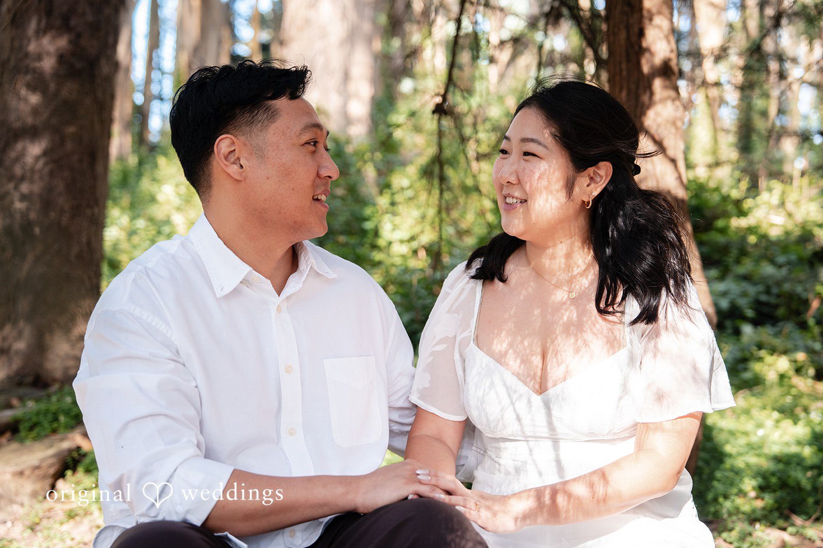 San Francisco Engagement Photography by Original Weddings capturing a couple laughing together during their outdoor engagement session at The Presidio