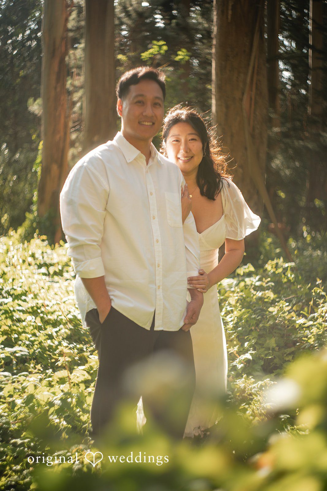 Couple sharing a beautiful moment together surrounded by greenery