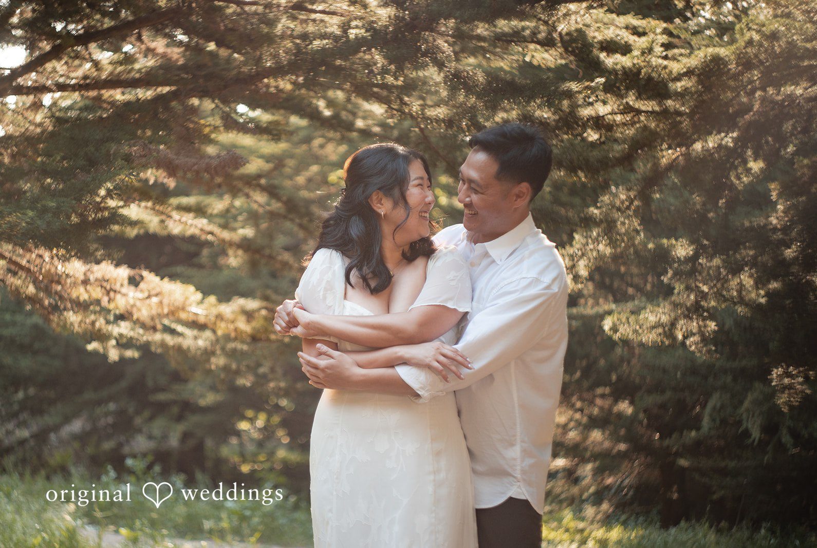 San Francisco engagement photography by Original Weddings capturing an intimate moment with soft lighting and beautiful background at The Presidio.