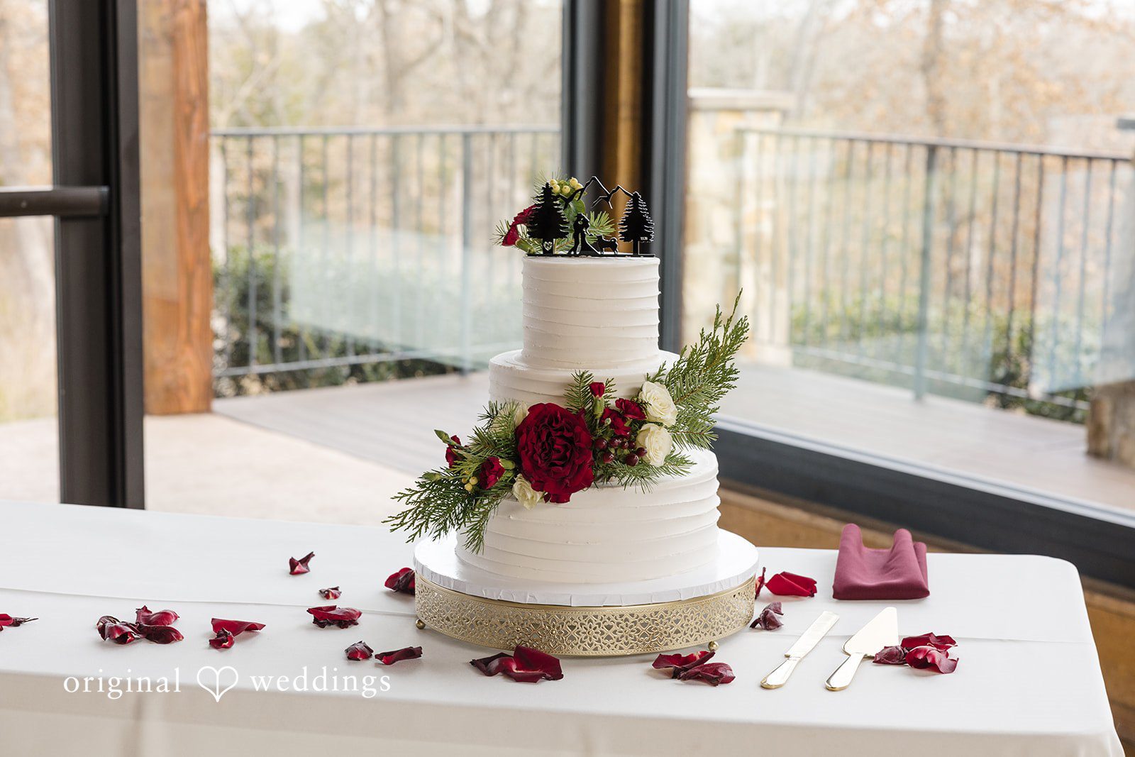 Wedding cake by window with floral details