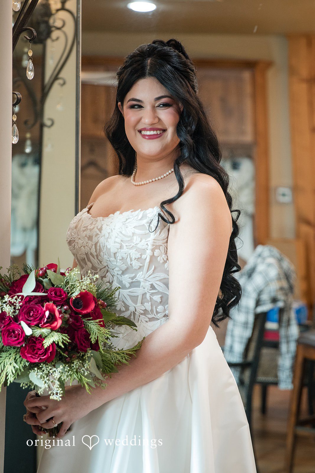 Bride holding red wedding bouquet