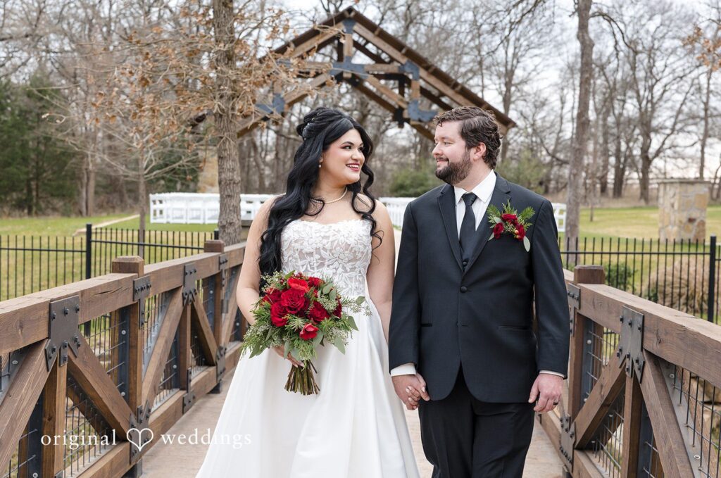 Bride and groom walking on bridge