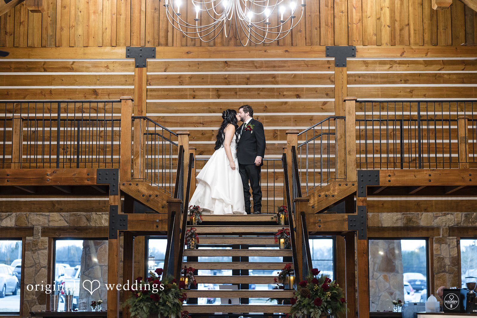 Couple portrait inside rustic wedding venue