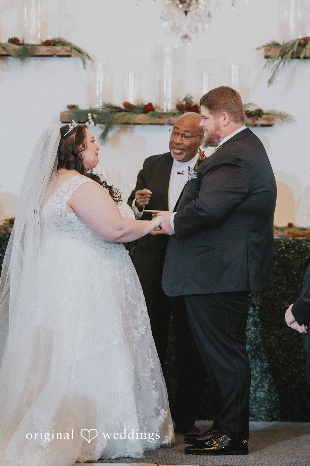 The priest blesses the couple’s union