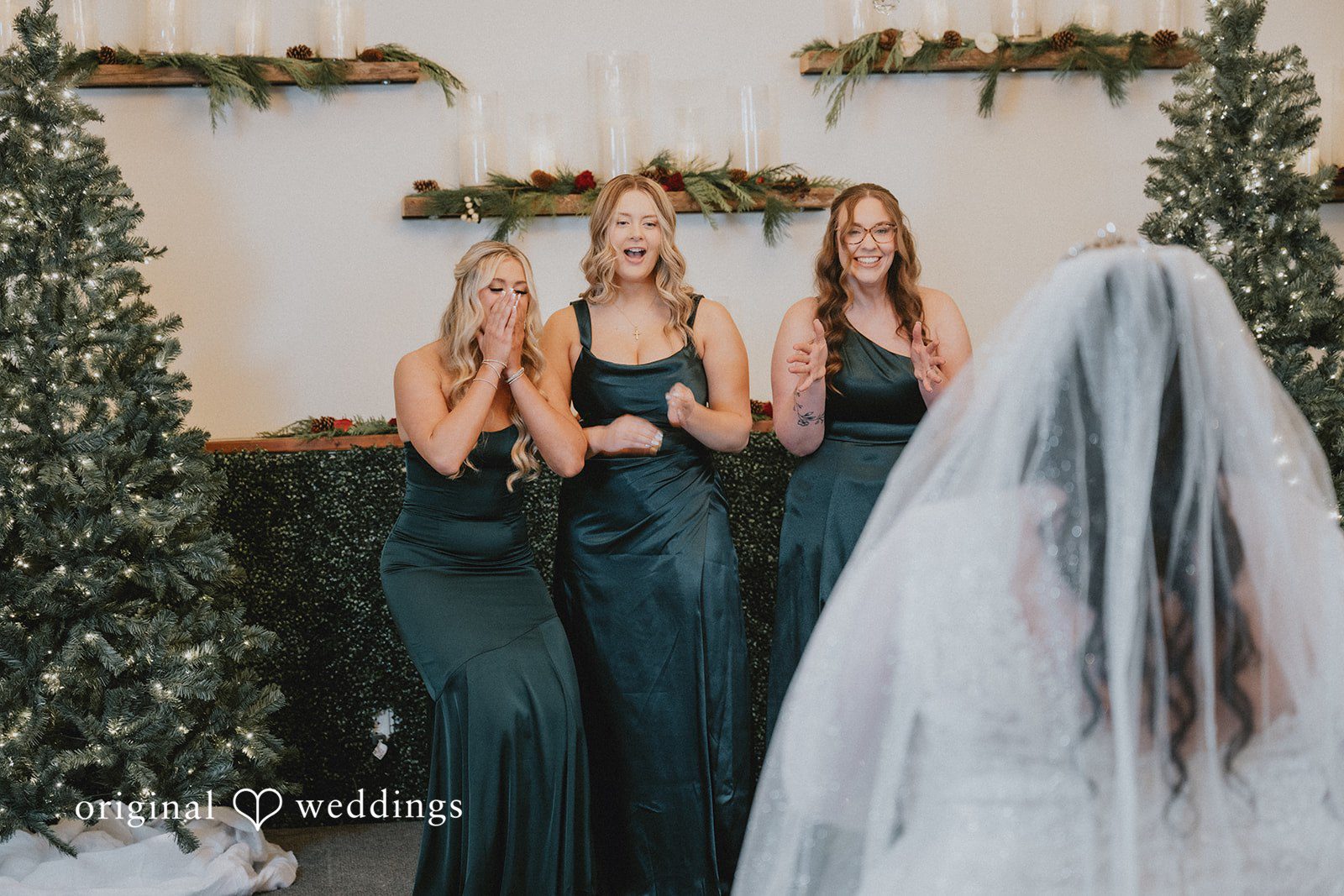 The bridesmaids are in awe of the bride