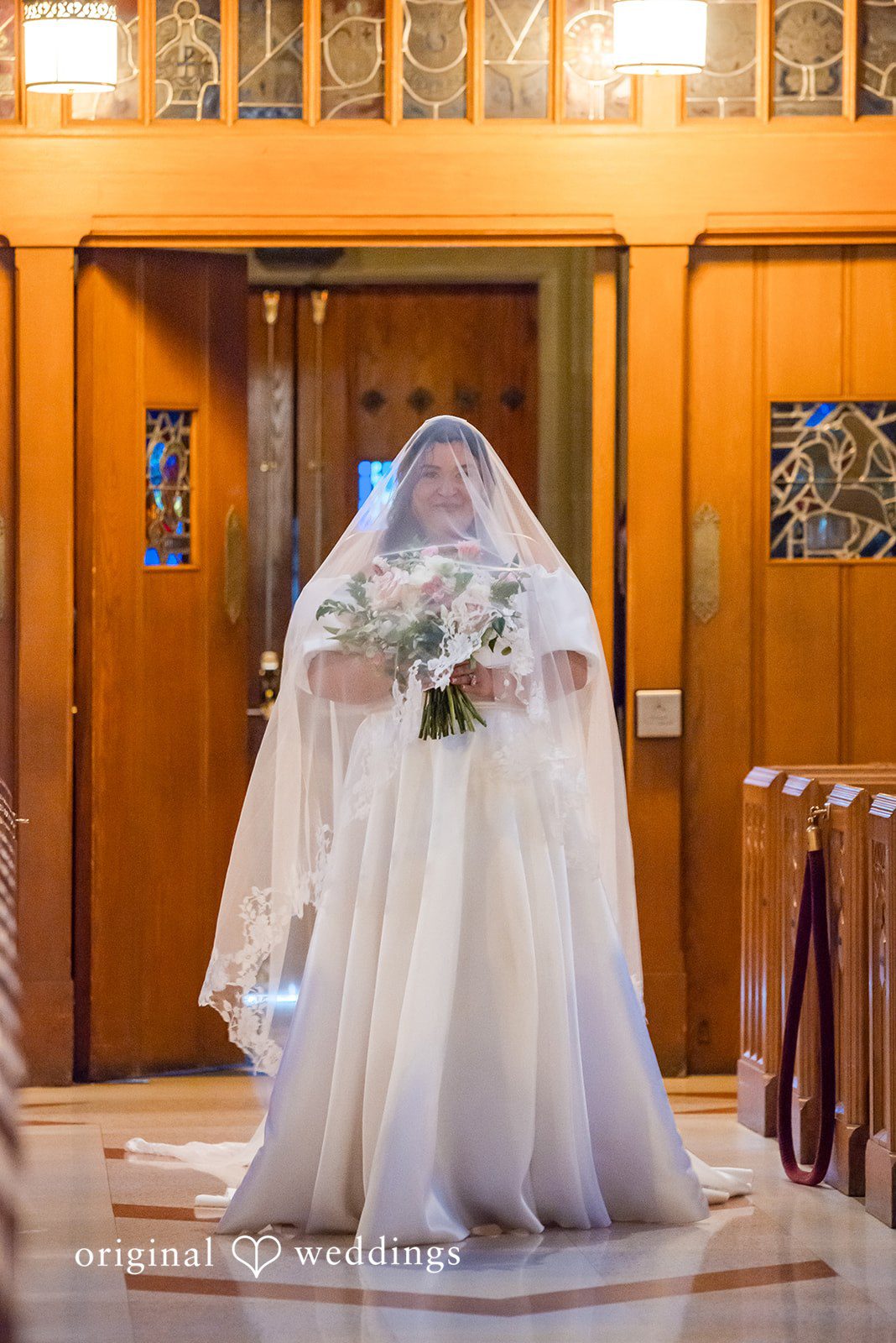 Paola + Jeremy Bride portrait holding bouquet inside the ceremony space