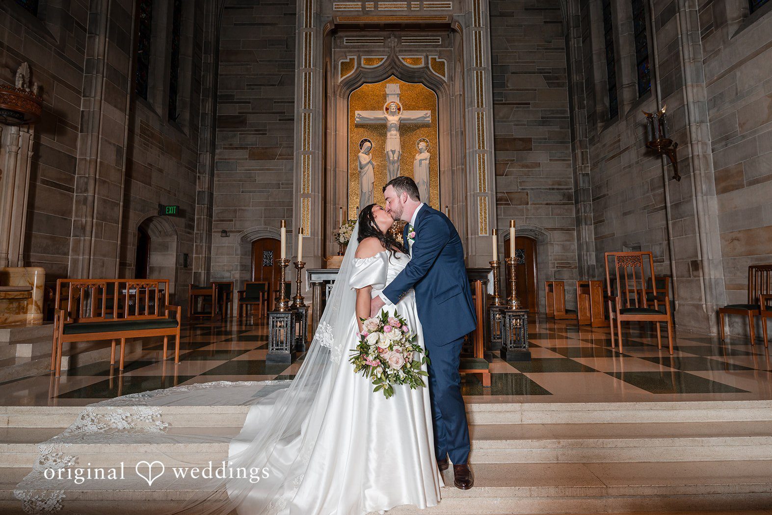 Romantic couple portrait in front of a grand altar captured by Atlanta Wedding Photographers in connection with The Sylvan Hotel wedding day, featuring elegant lighting and timeless composition