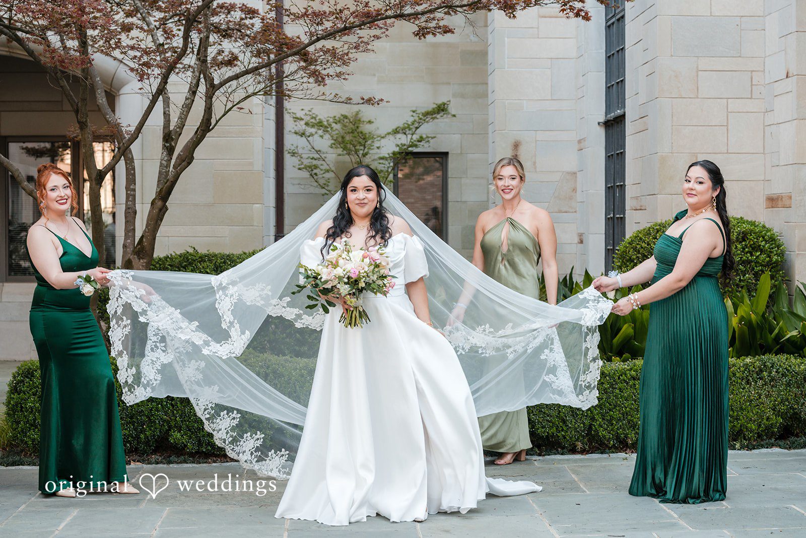 Paola + Jeremy Bride with bridesmaids holding veil outdoors