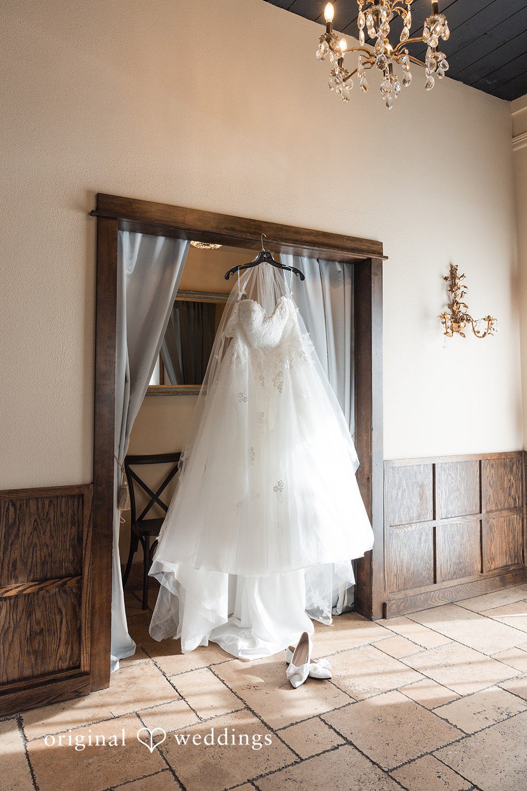 Wedding dress hanging inside the bridal suite
