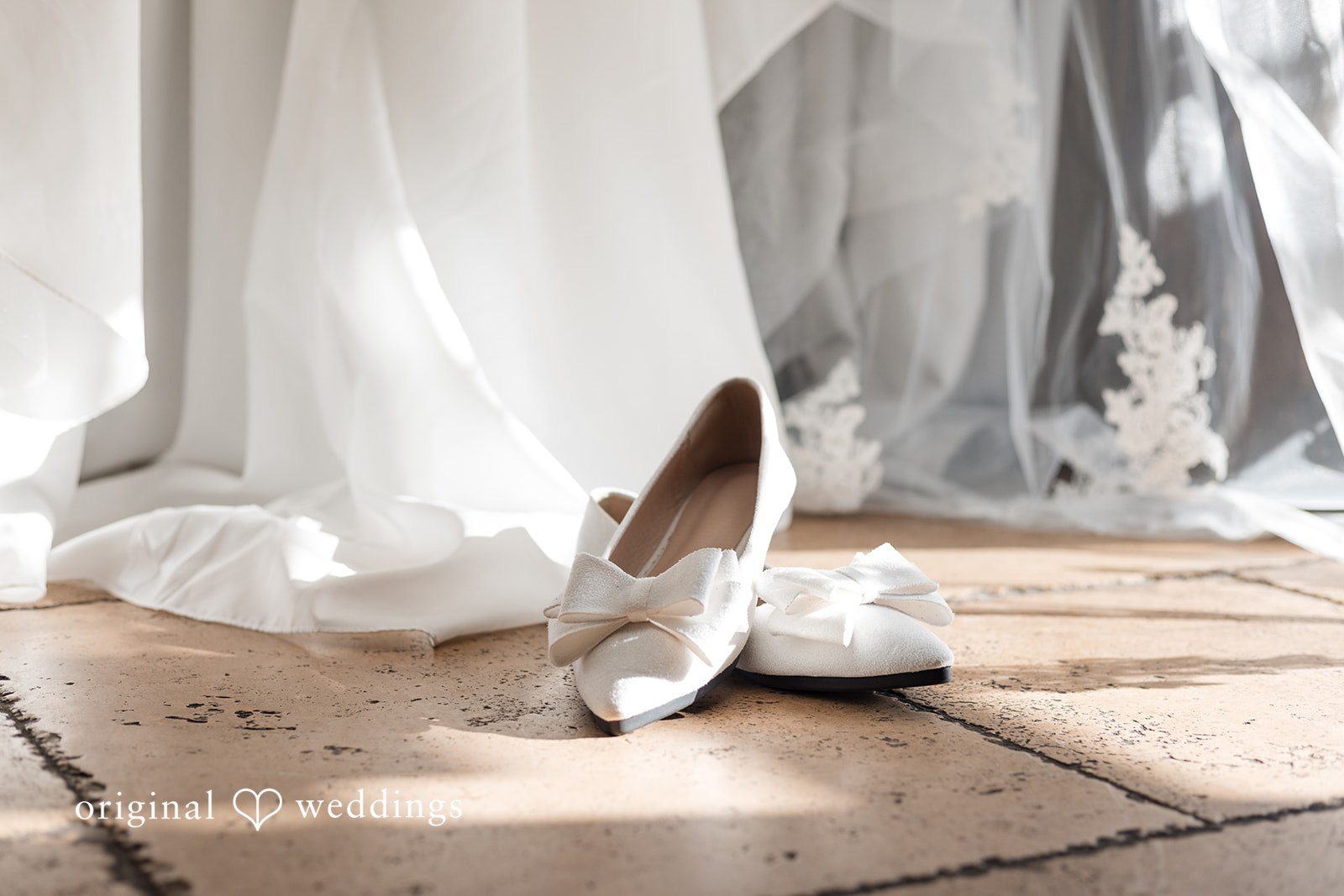 Bridal shoes detail beside the wedding dress