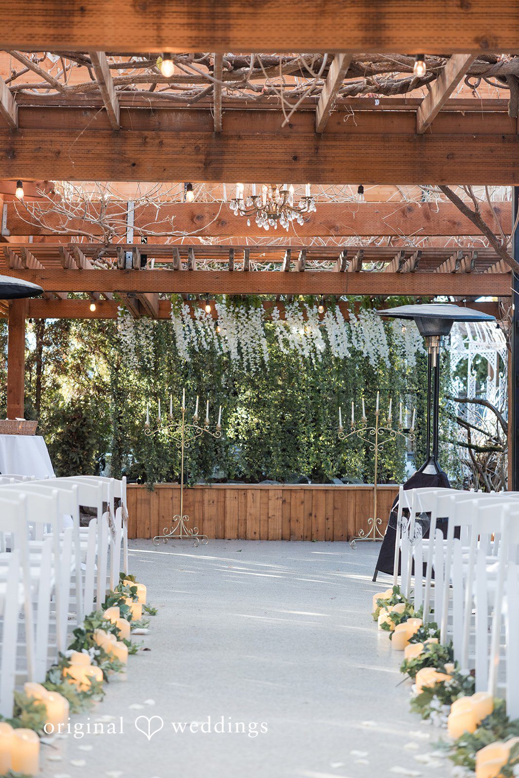 Outdoor ceremony setup at The Troutdale House with elegant floral aisle decor