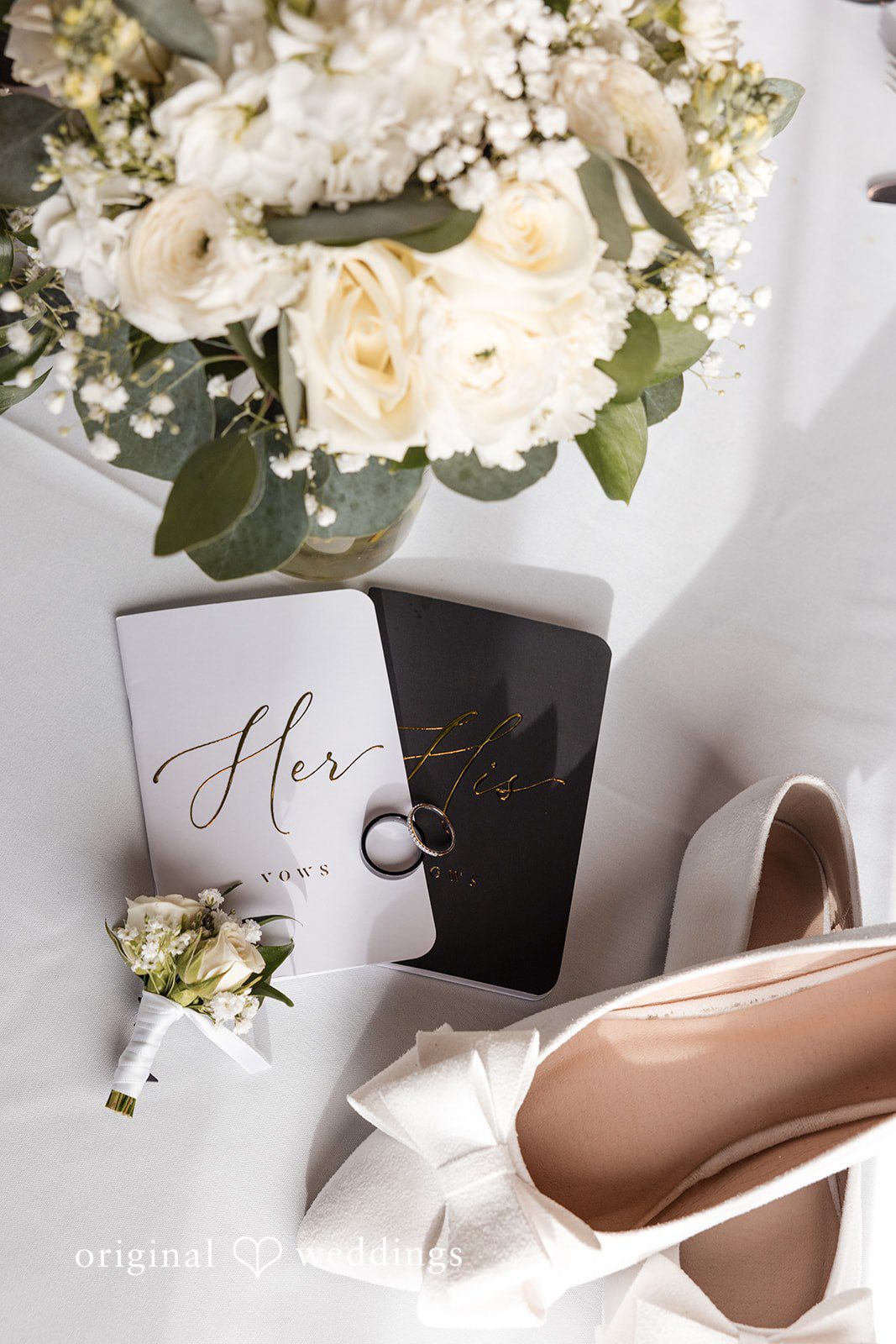 Wedding details featuring invitation suite, shoes, and bouquet