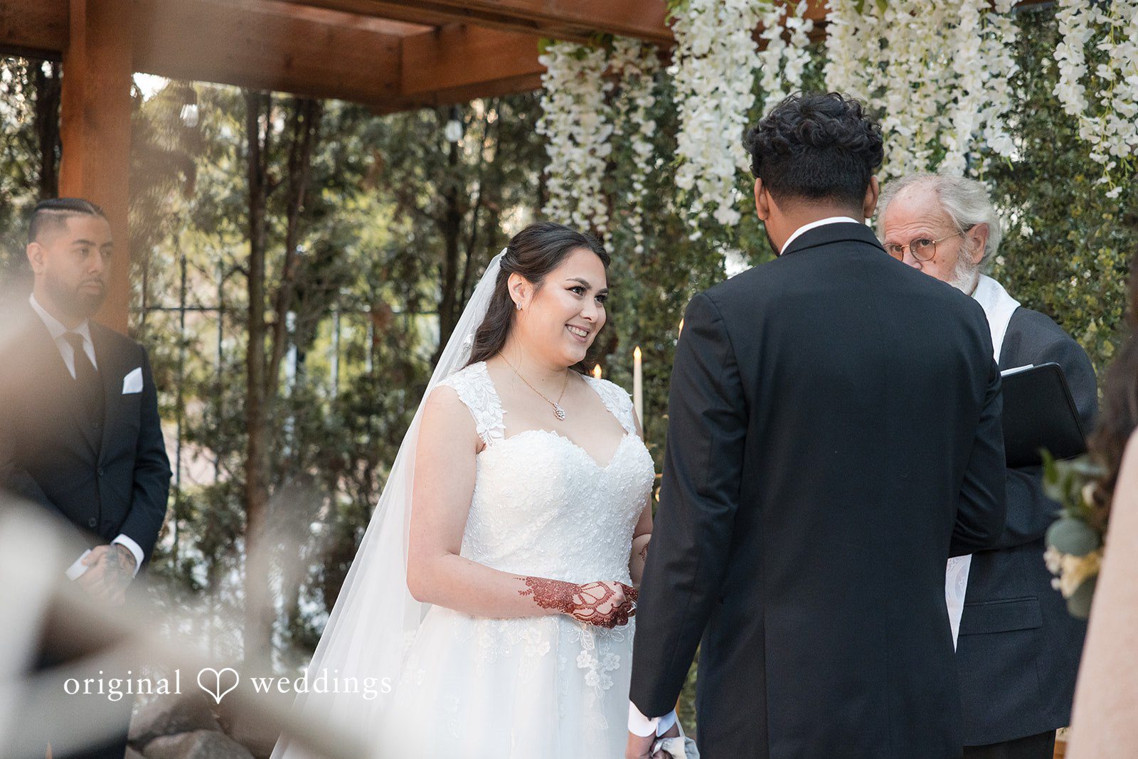 Couple standing together during the outdoor ceremony