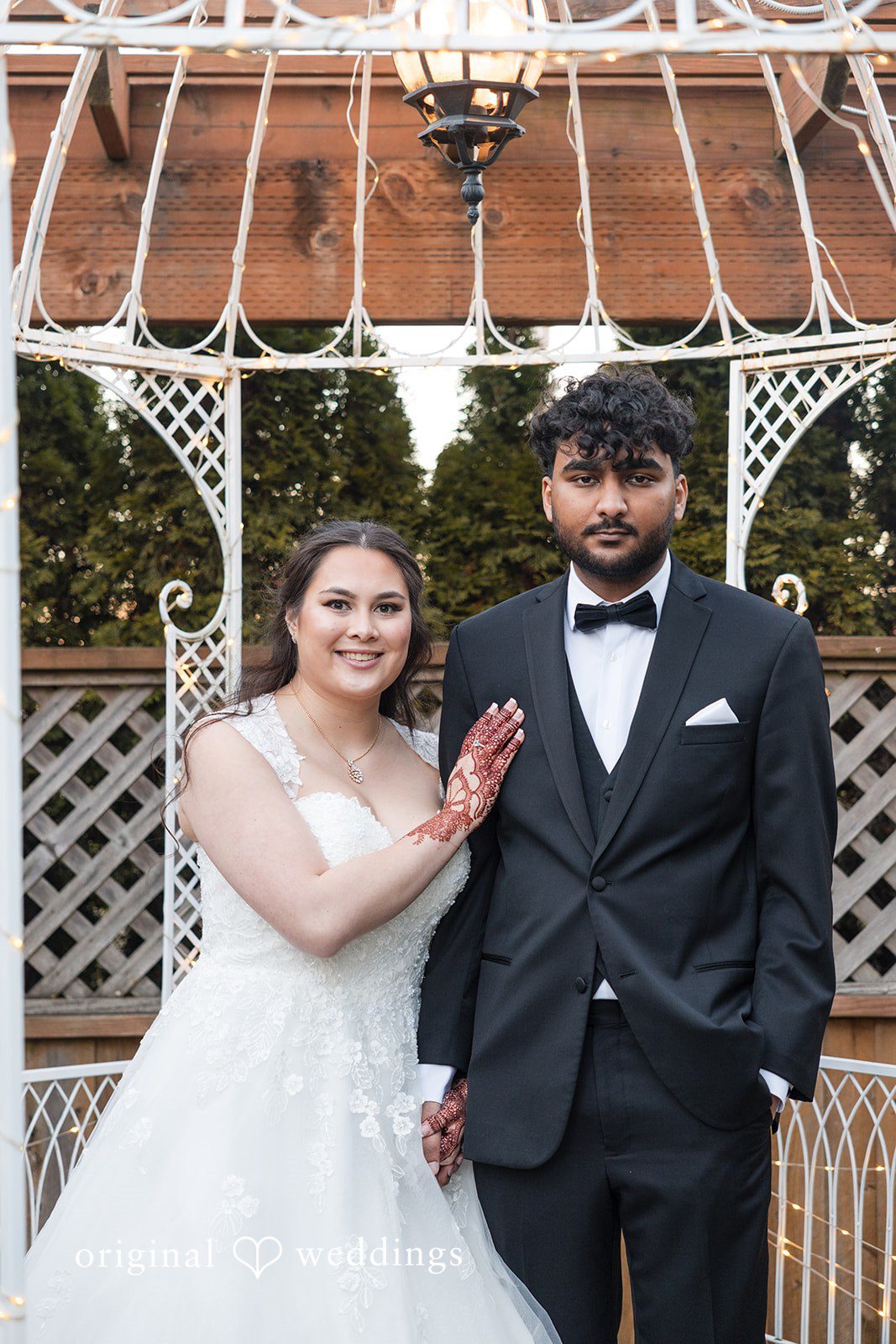 Bride and groom portrait in front of the gazebo