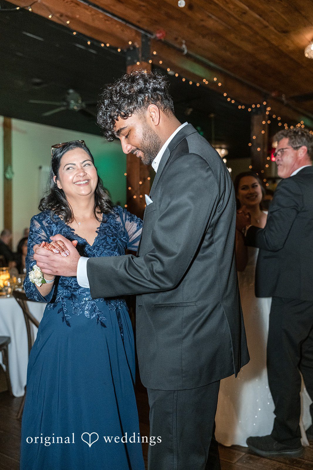 Groom dancing with him mother during the reception