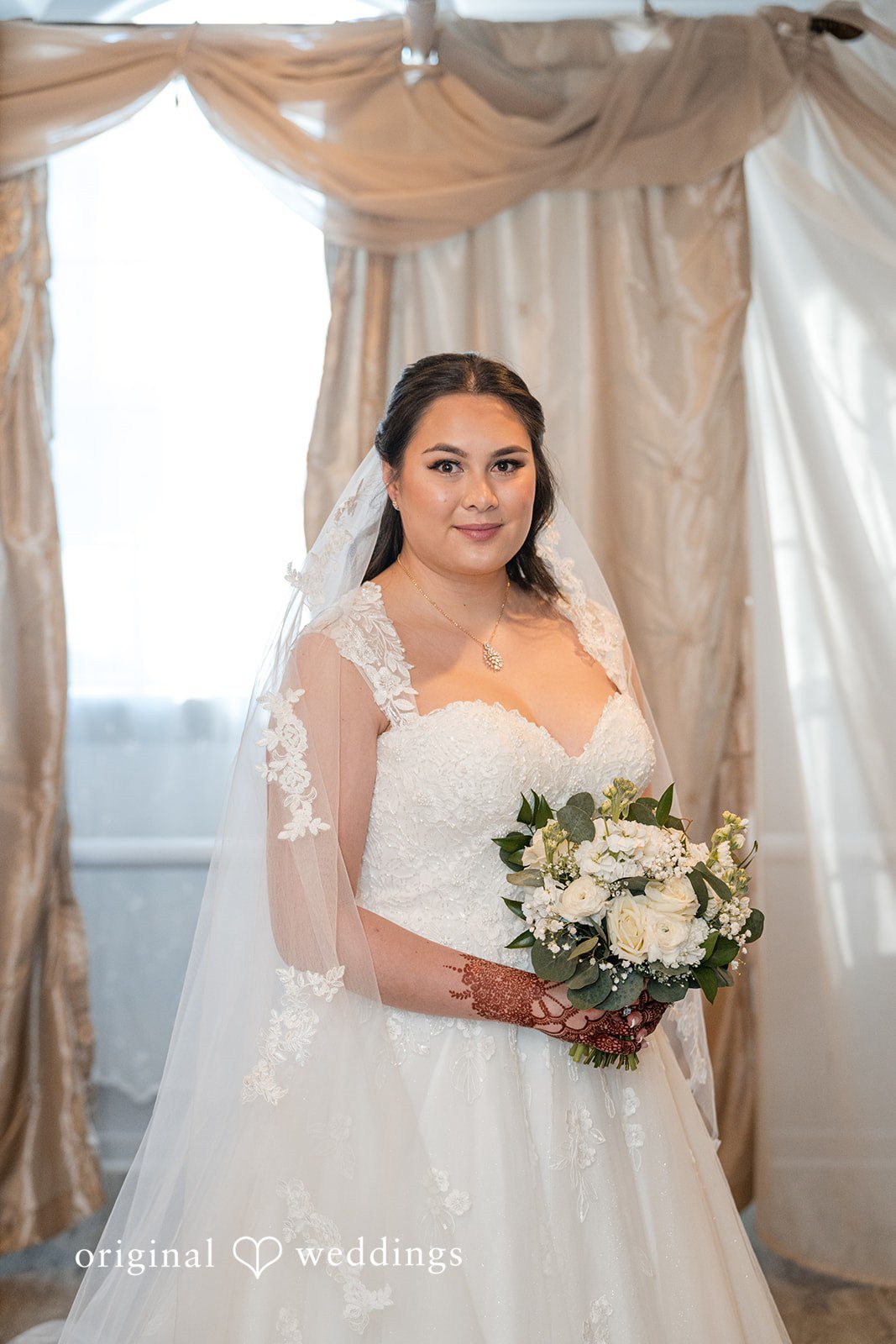 Bride holding bouquet during bridal portraits