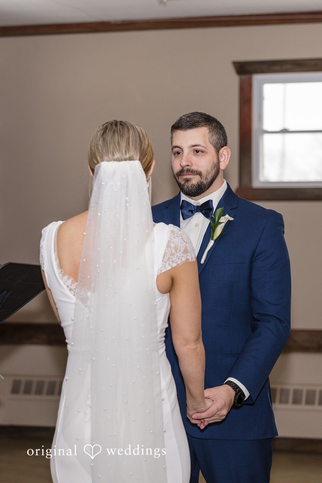 Alia + Lance Bride and groom facing each other at the altar during their vows.