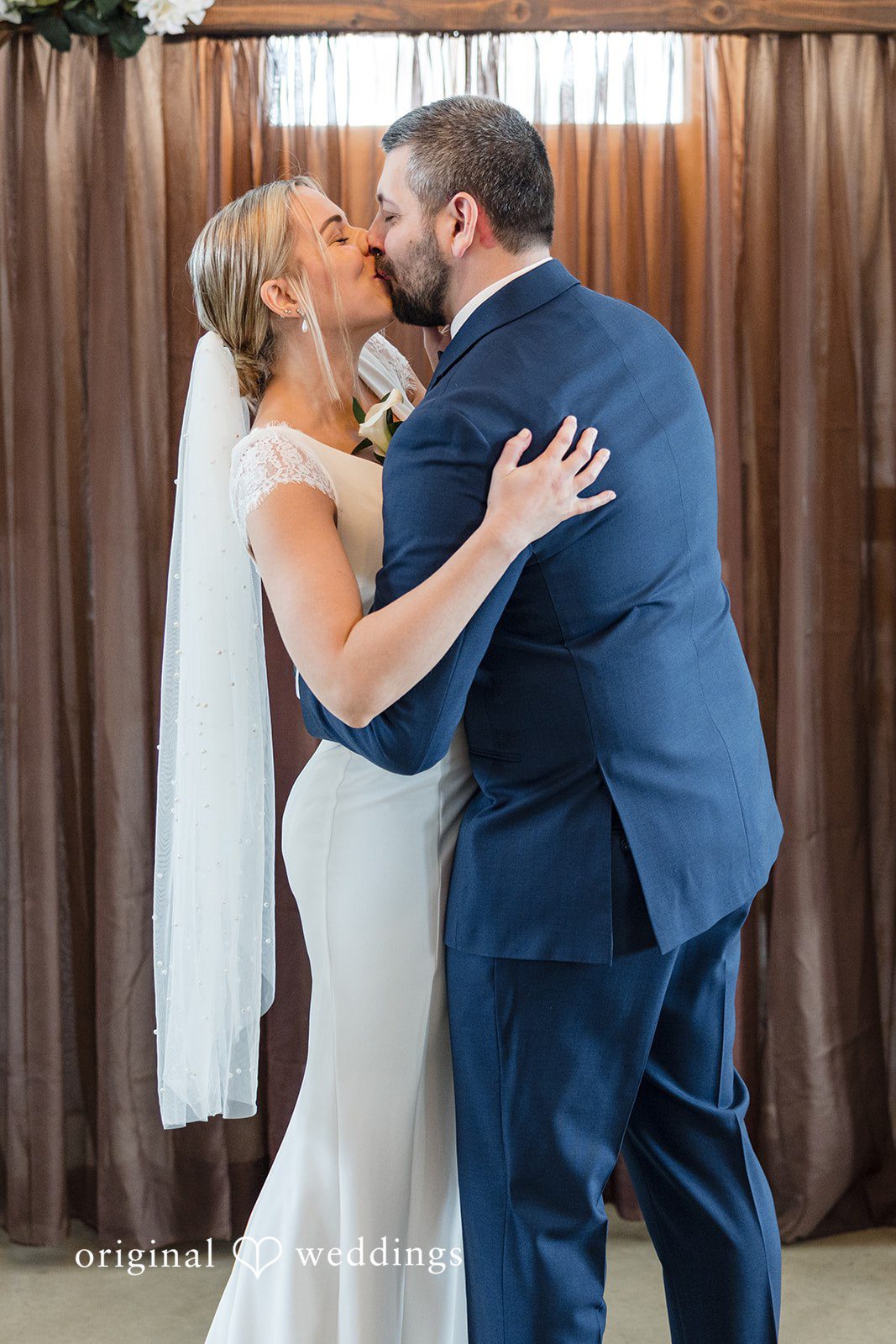Alia + Lance Bride and groom sharing their first kiss as husband and wife.