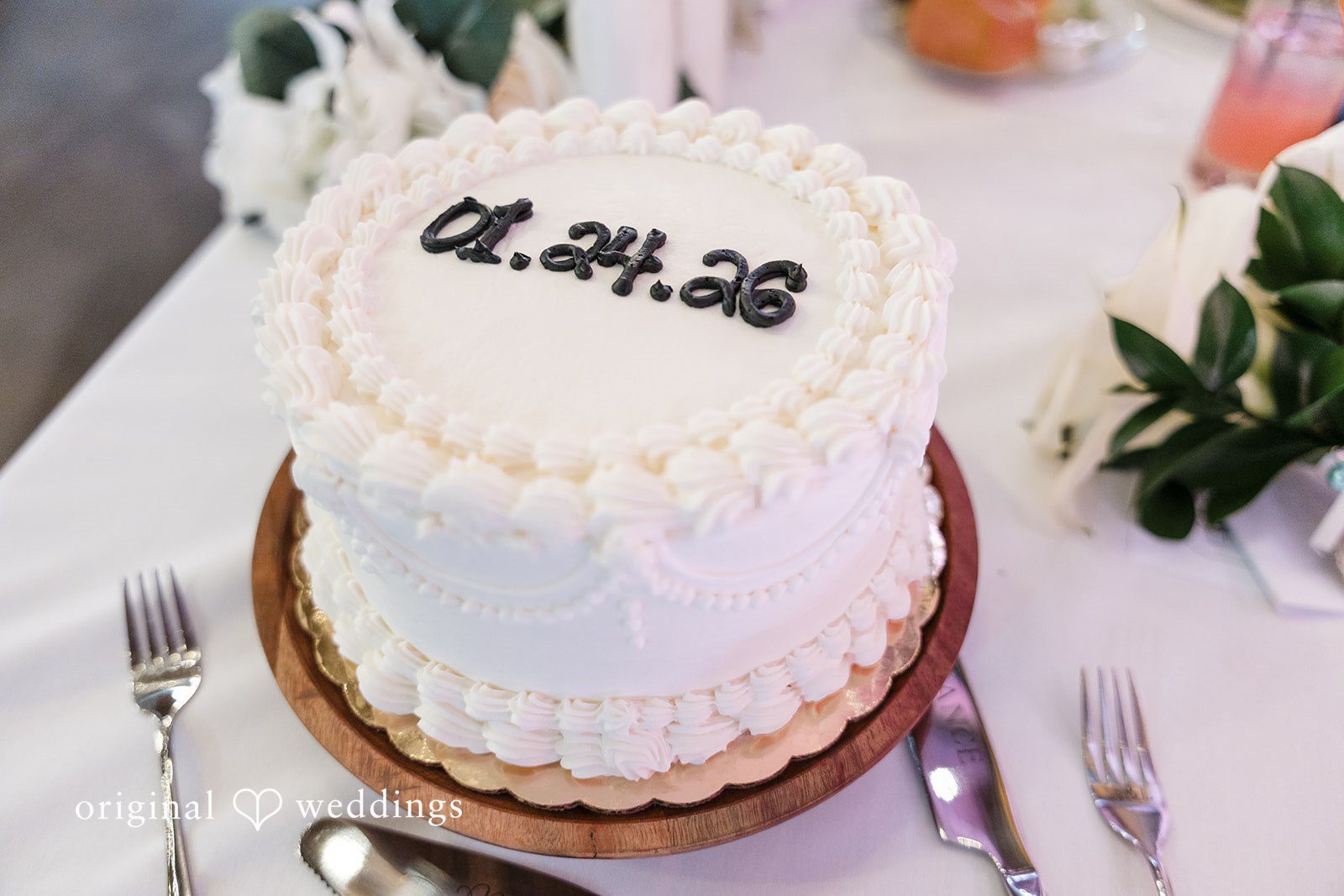 Alia + Lance White textured wedding cake with the date written on top.