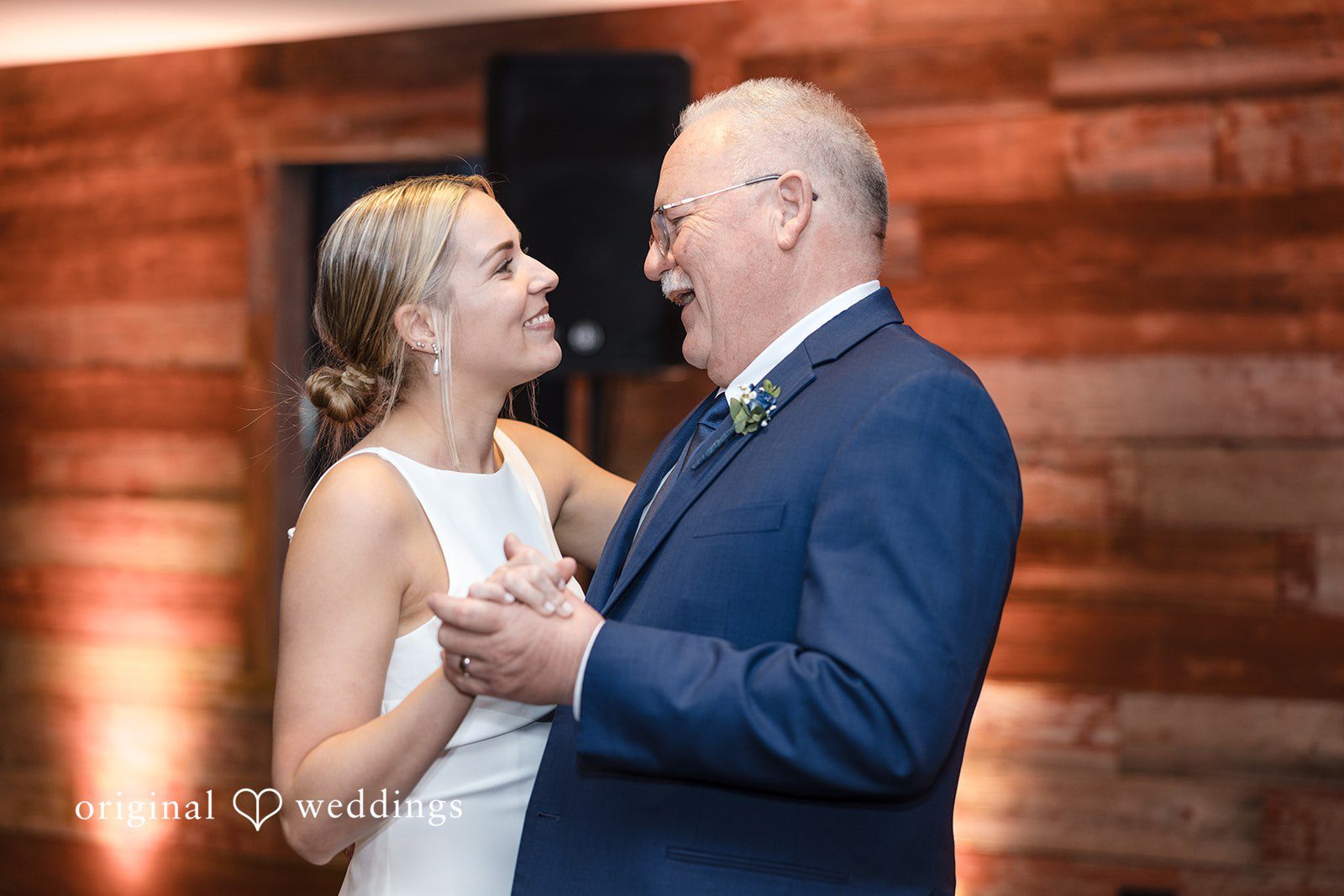Alia + Lance Bride smiling and dancing with an older man in a blue suit.