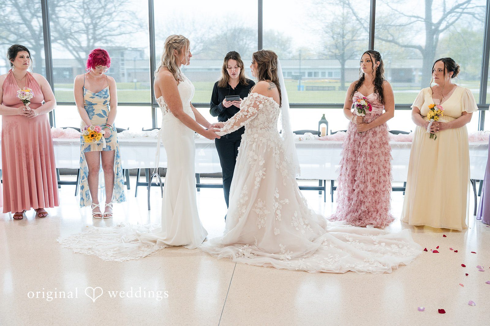 Bride and bride kissing after their wedding ceremony