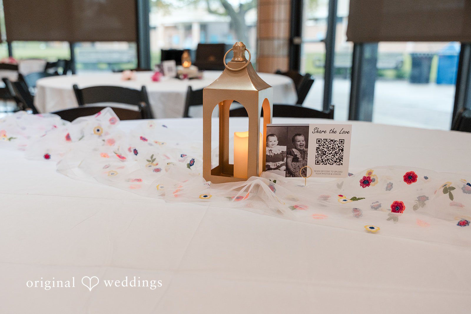 Wedding reception table decor with candles and floral arrangements