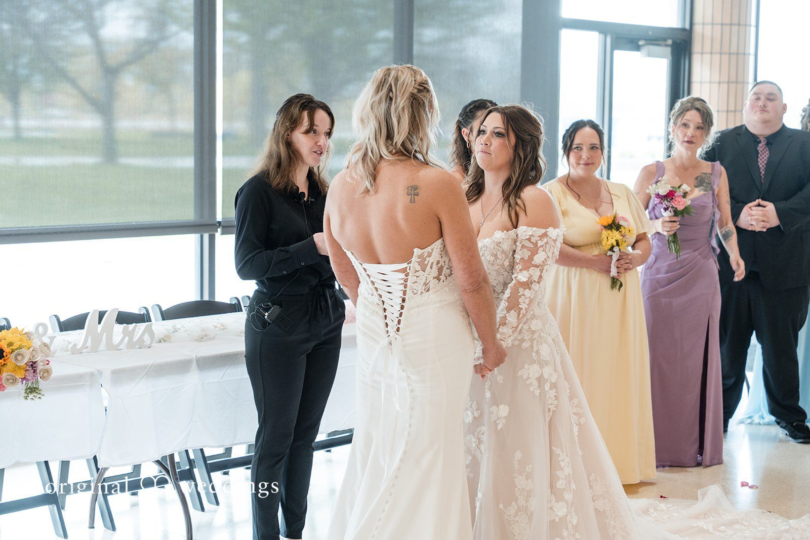 Bride and bride exchanging vows during the wedding ceremony
