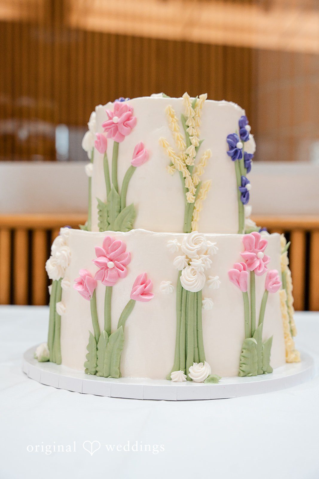 Floral wedding cake decorated with elegant pastel flowers