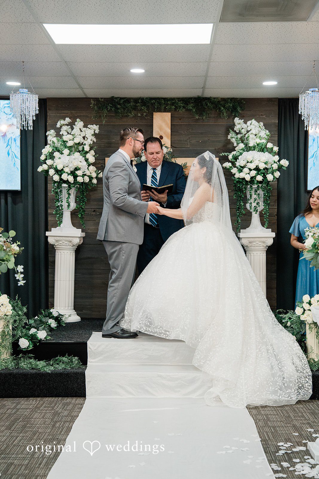 Los Angeles wedding photography by original weddings at Towngate Community Center capturing Bride and groom exchanging vows
