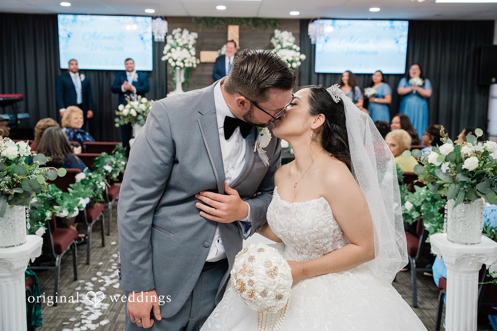 Bride and groom sharing their first kiss