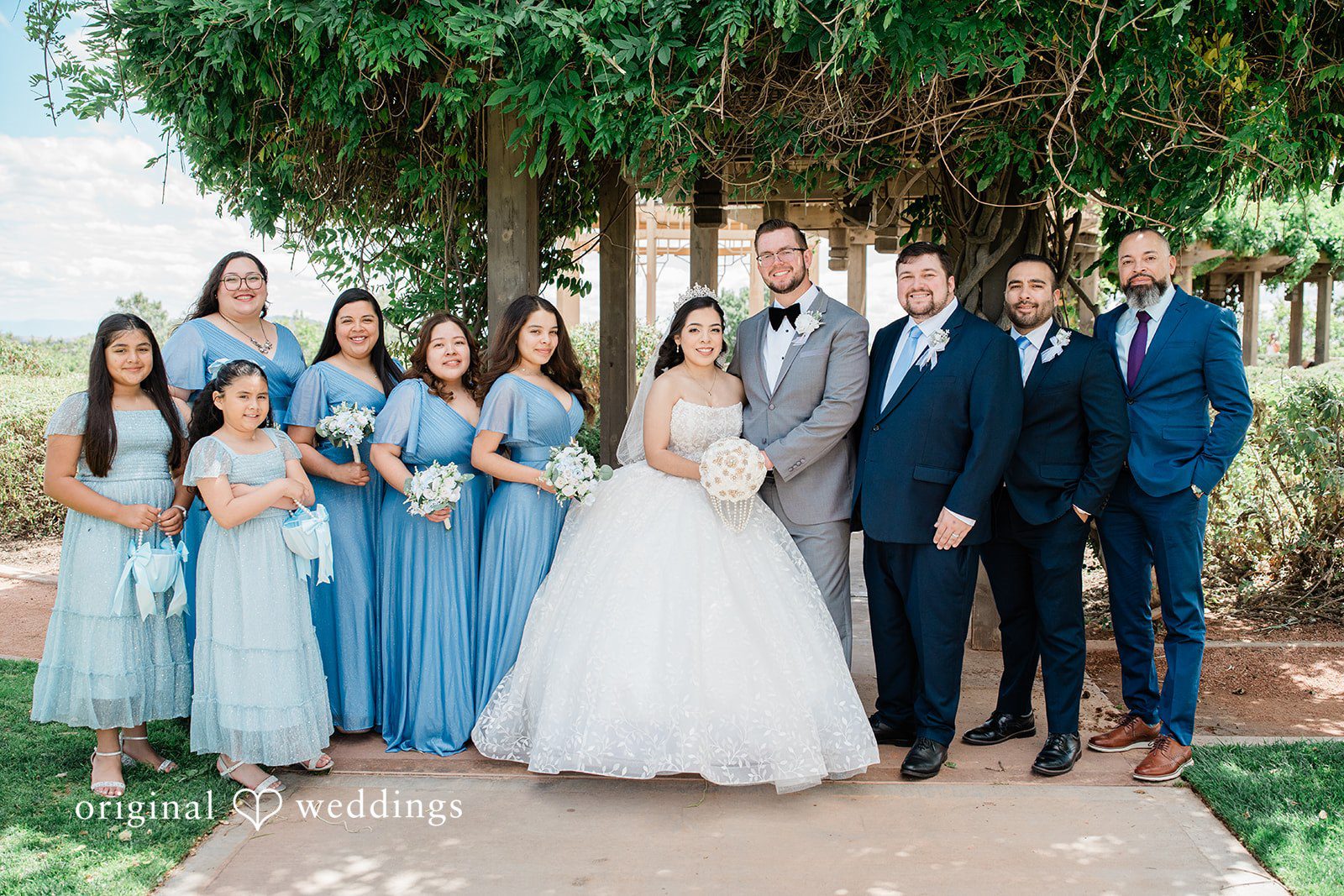 Bride and groom with family and bridal party at Towngate Community Center