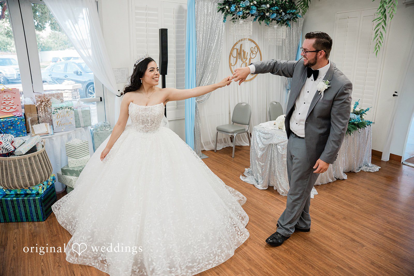 Bride and groom twirl dance at Towngate Community Center